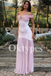 Blush Pink Off-the-Shoulder Prom Dress with Gold Floral Brooch and Pleated Skirt